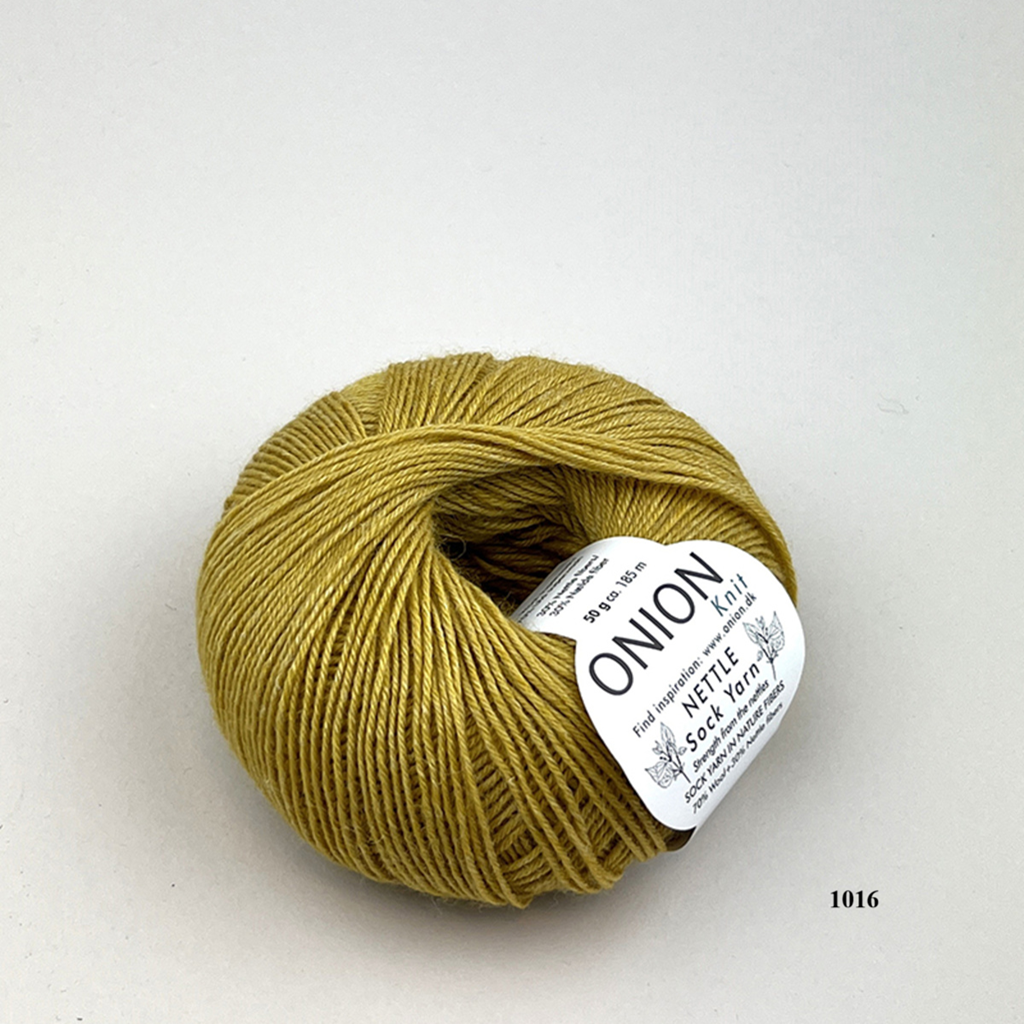 Curry  1016 Onion Nettle Sock Yarn is available to buy online from UK wool shop, Ida's House.